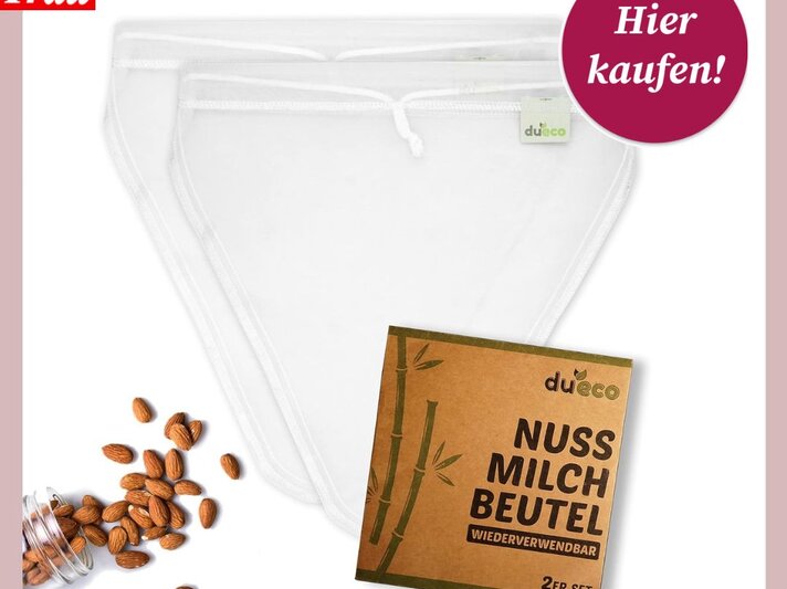 Ein Produktbild von wiederverwendbaren Nussmilchbeuteln der Marke "dueco", bestehend aus einem 2er-Set. Neben den weißen, feinmaschigen Beuteln sind ein Glas mit Mandeln und die Verpackung aus braunem Karton abgebildet. Im oberen rechten Bereich steht im Kreis "Hier kaufen!". Links oben ist das "Bild der Frau"-Logo zu sehen. | © DuEco via Amazon.de