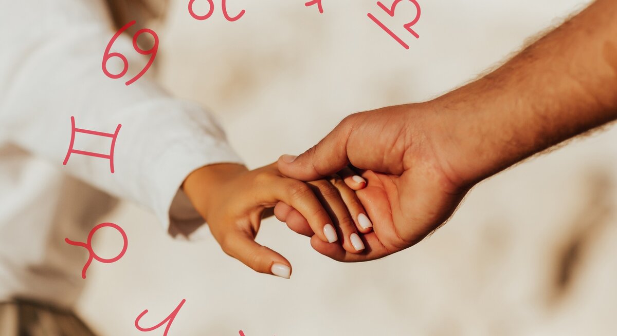 Closeup der Hand einer Frau, die ihre in die Hand eines Mannes legt. Umgeben von den astrologischen Zeichen des Tierkreises. 