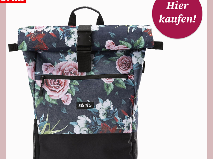 Moderner Rucksack mit dunkelblauem Hintergrund und großem, buntem Blumenmuster, vorn Reißverschluss und Label "Ela Mo". | © Amazon/Canva/Collage:bildderfrau.de
