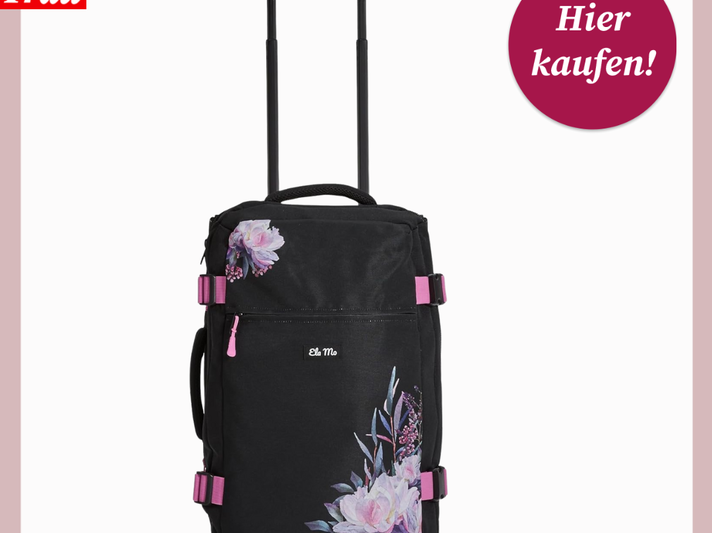 Schwarzer Trolley mit ausziehbarem Griff, pinken Schnallen und großen, gemalten Pfingstrosen in Rosa und Lila. | © Amazon/Canva/Collage:bildderfrau.de