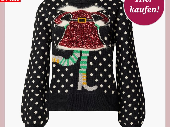 Schwarzer Weihnachtspullover mit weißen Punkten und glitzerndem Motiv einer Elfenfigur in rotem Kleid und gestreiften Strümpfen. | © Peek & Cloppenburg Düsseldorf