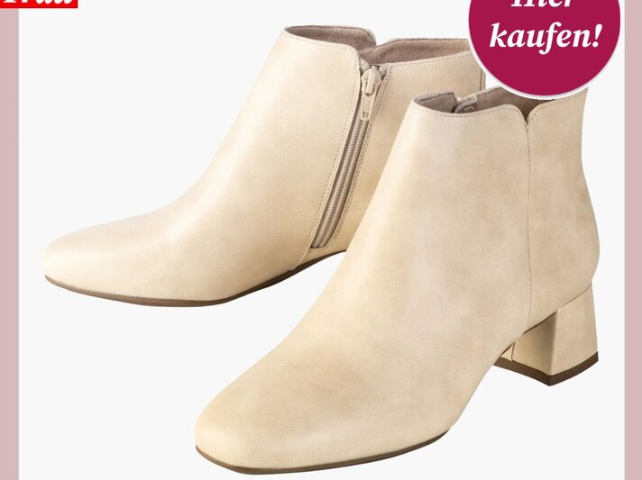 Cremefarbene Ankle-Boots mit Blockabsatz und seitlichem Reißverschluss auf weißem Hintergrund. | © Lidl