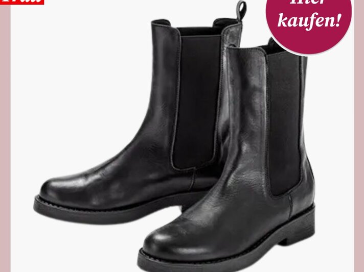 Paar elegante, schwarze Lederstiefeletten im klassischen Chelsea-Design mit leichtem Glanz. | © Tchibo
