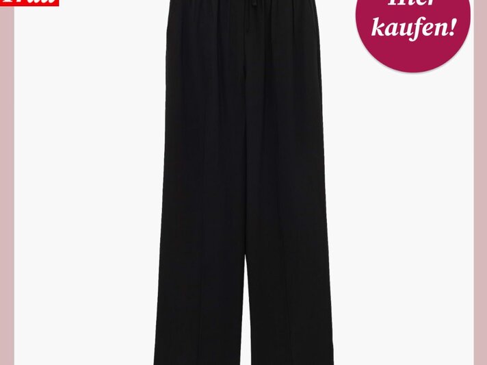 Weite schwarze Hose mit elastischem Bund und Kordelzug vor weißem Hintergrund, oben links Logo "Bild der Frau" | © Someday