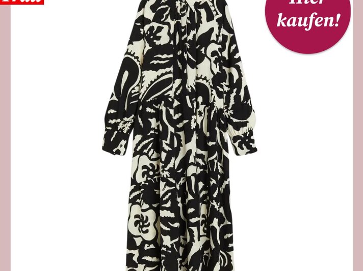 Ein Blusenkleid mit schwarz-weißem Blumenmuster ist zentral auf einem weißen Hintergrund mit rosa Umrandung abgebildet. In der oberen rechten Ecke befindet sich ein runder, magentafarbener Button mit der Aufschrift "Hier kaufen!". In der oberen linken Ecke ist das Logo "Bild der Frau" in Rot und Weiß zu sehen. | © H&M